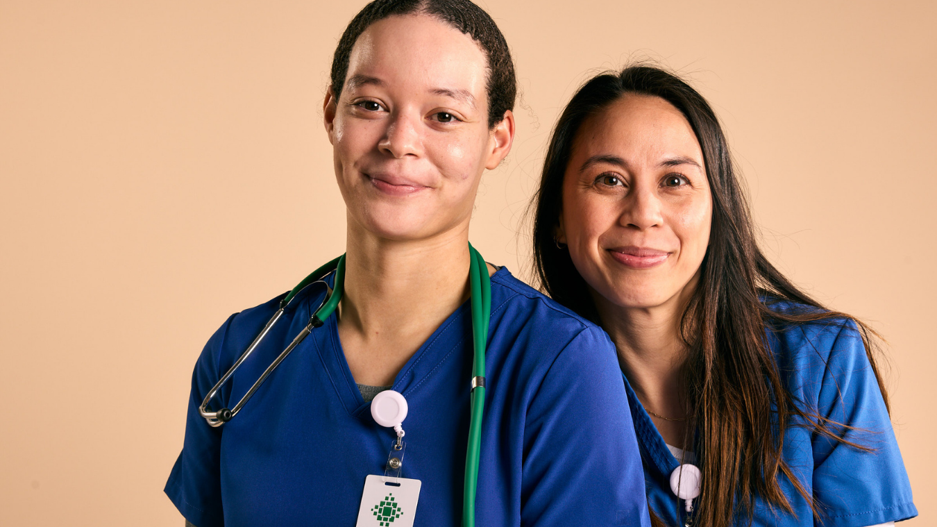 two nurses smiling together