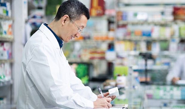 Pharmacist logging a prescription