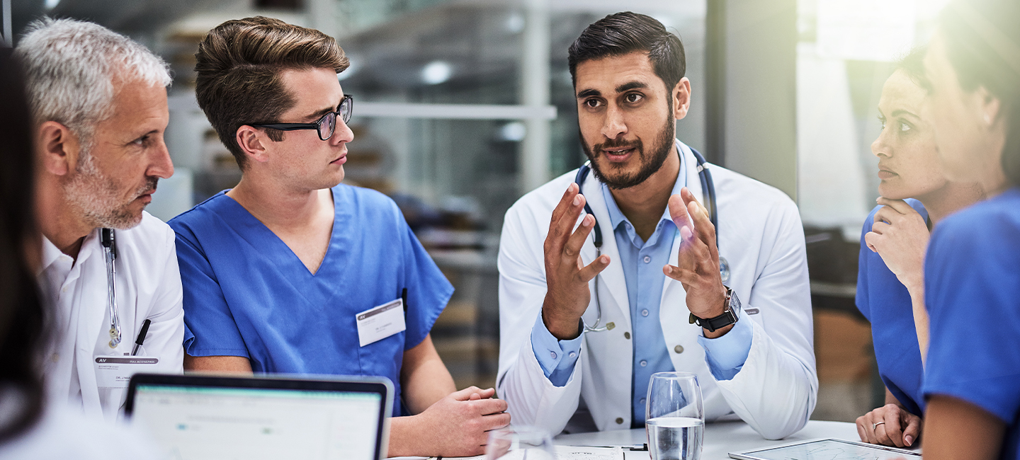 Doctor talking to team